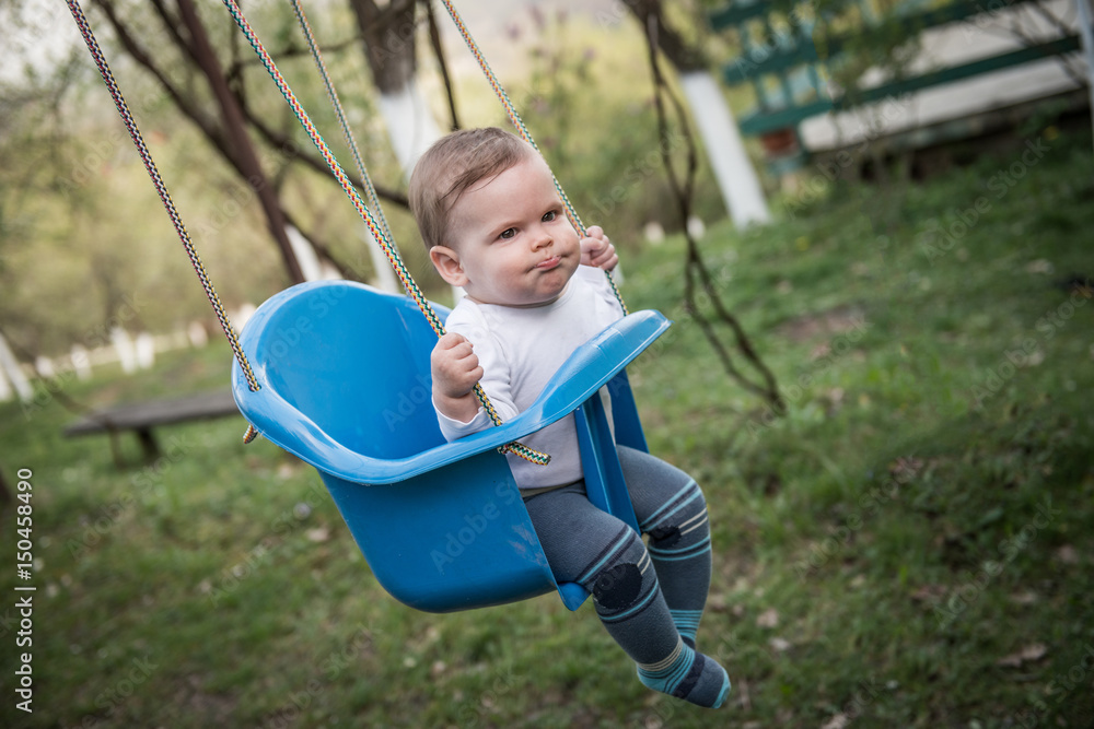 Little girl swinging Little girl swinging