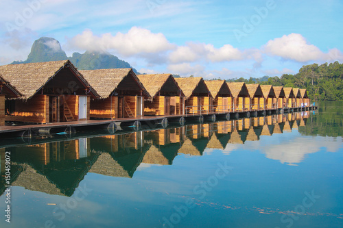 Floating houses on the lake. Water reflection.  photo