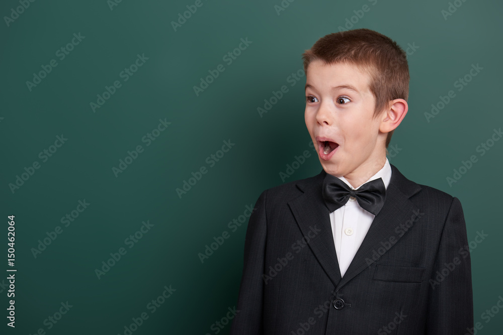 boy at blank chalkboard