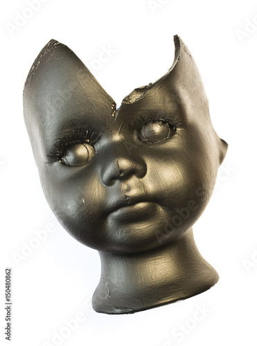 Broken Doll Head Painted Black on White Background