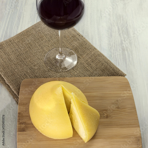 Tetilla, traditional Spanish cheese, with a glass of wine photo