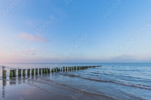 Wave Breaker - Wooden Piles  At Sunrise © Bjoern Bernhard