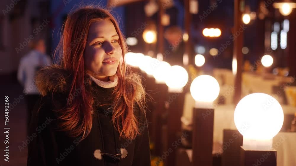 Cute teen girl on a night city streets. Cute teen girl on a night city streets.