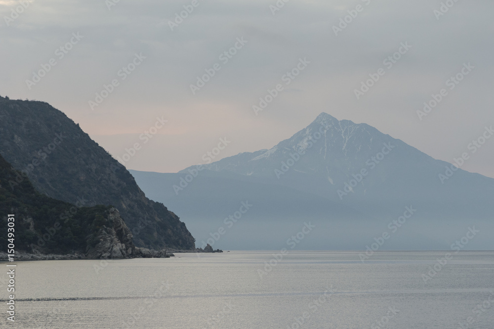 Beautiful seascape with mountains in Greece, at sunset
