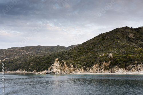 Beautiful coastline with mountains and rocks in Greece, photographed from the sea 