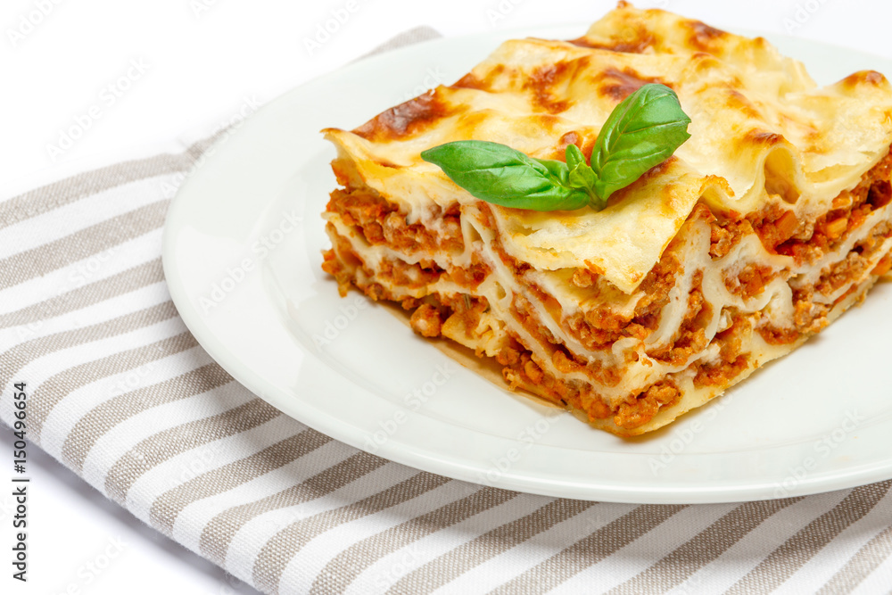 Portion of tasty lasagna isolated on white Portion of tasty lasagna isolated on white