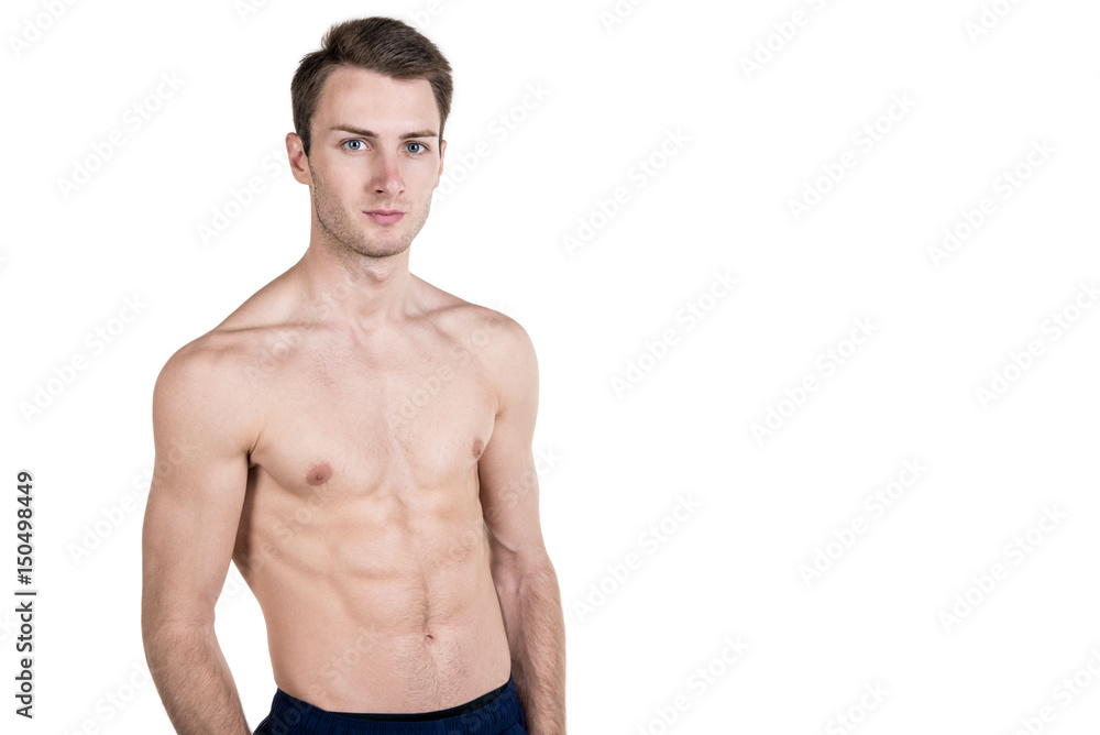 Healthy lifestyle and fitness. Handsome guy sports physique, with a naked body, on the left side of the frame, isolated on a white background. Horizontal frame Healthy lifestyle and fitness. Handsome guy sports physique, with a naked body, on the left side of the frame, isolated on a white background. Horizontal frame