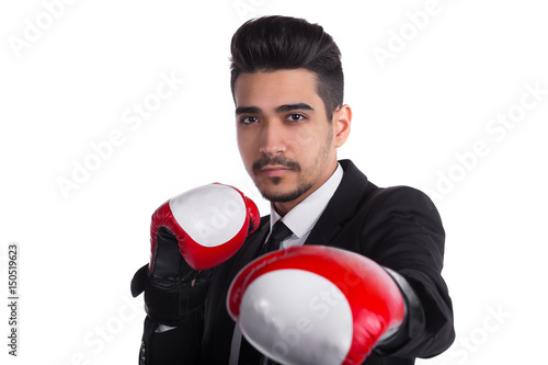 close up of successful businessman in black suit and red boxing gloves