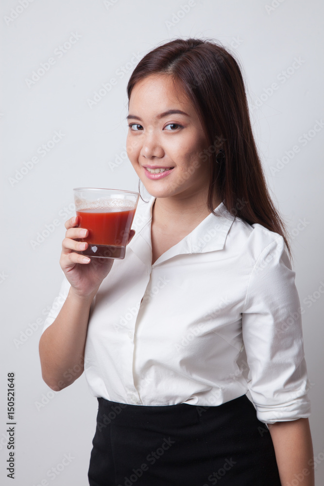 Young Asian woman drink tomato juice. Young Asian woman drink tomato juice.
