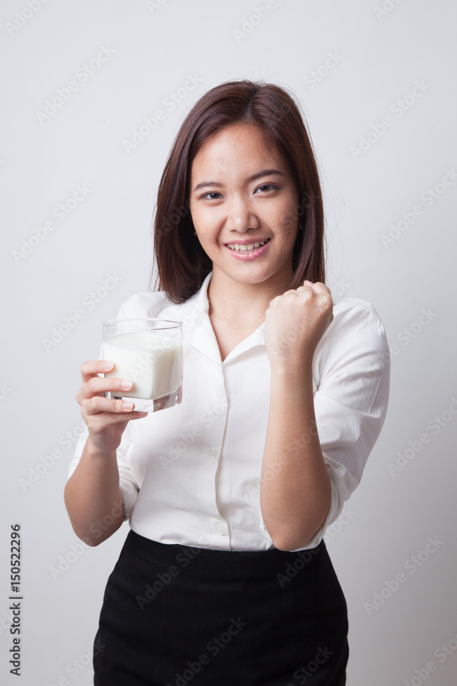 Healthy Asian woman drinking a glass of milk. Healthy Asian woman drinking a glass of milk.