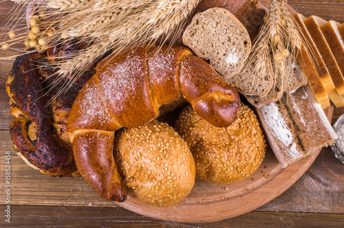 Bread and pastries on a wooden background