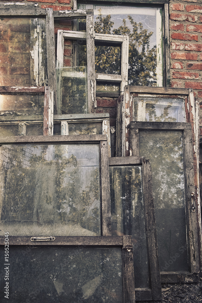 Old abandoned cracked wooden window frames