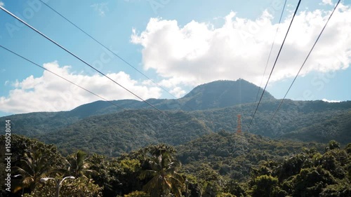 4k UHD Funicular with a view of Puerto Plata beautifull epic mountain with green trees blue sky clouds Dominican Republic photo