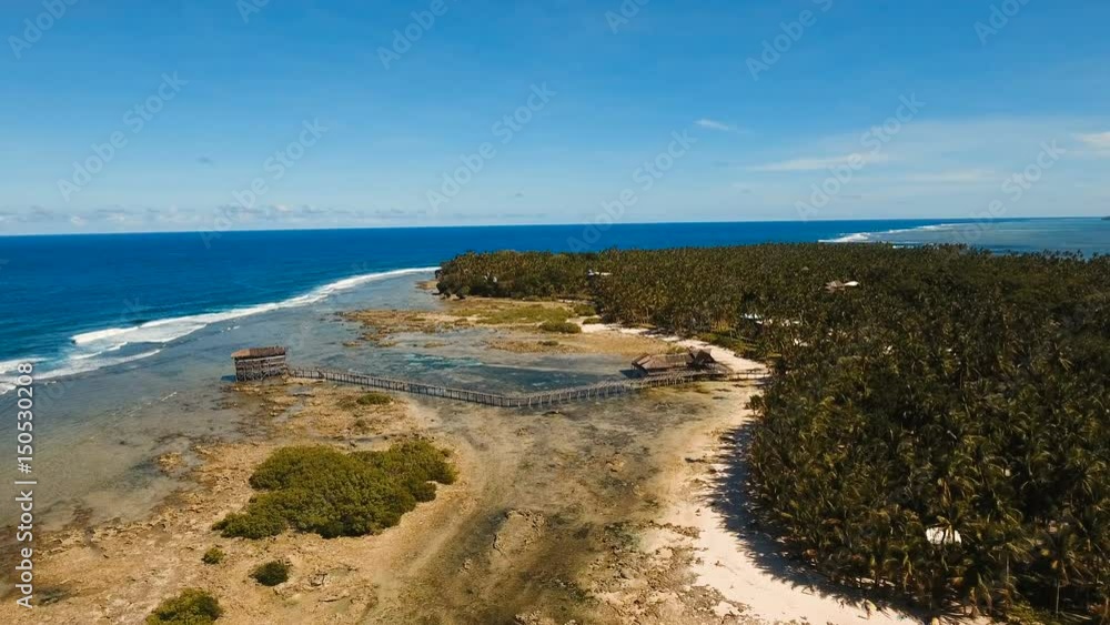 Viewpoint in the ocean at Cloud Nine surf point, Siargao island , Philippines. Aerial view raised wooden walkway for surfers to cross the reef of siargao island to cloud 9 surf break mindanao. Siargao Viewpoint in the ocean at Cloud Nine surf point, Siargao island , Philippines. Aerial view raised wooden walkway for surfers to cross the reef of siargao island to cloud 9 surf break mindanao. Siargao