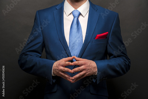 Tela Man gentleman in black suit and tie