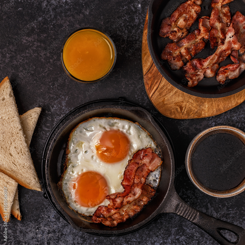 Breakfast with bacon , fried egg, coffee and orange juice. Breakfast with bacon , fried egg, coffee and orange juice.