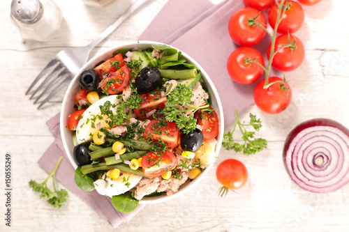 tuna salad with tomato,olive and egg