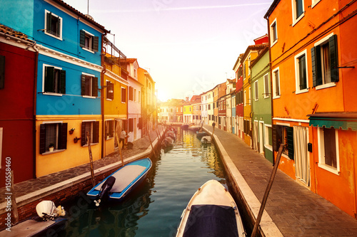 Beautiful Sunset with Boats, Buildings and Water. Sun Light. Toning. Burano, Italy. © nerudol