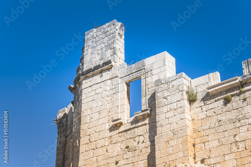 old ruin wall with blue sky