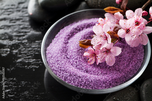 Spa Concept. Closeup of beautiful Spa Products - Spa Salt and Flowers. Horizontal.