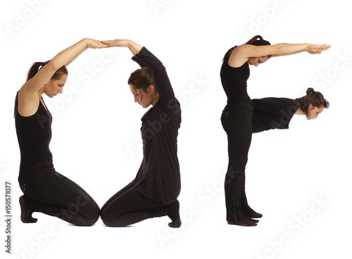 Black dressed people forming word OF photo