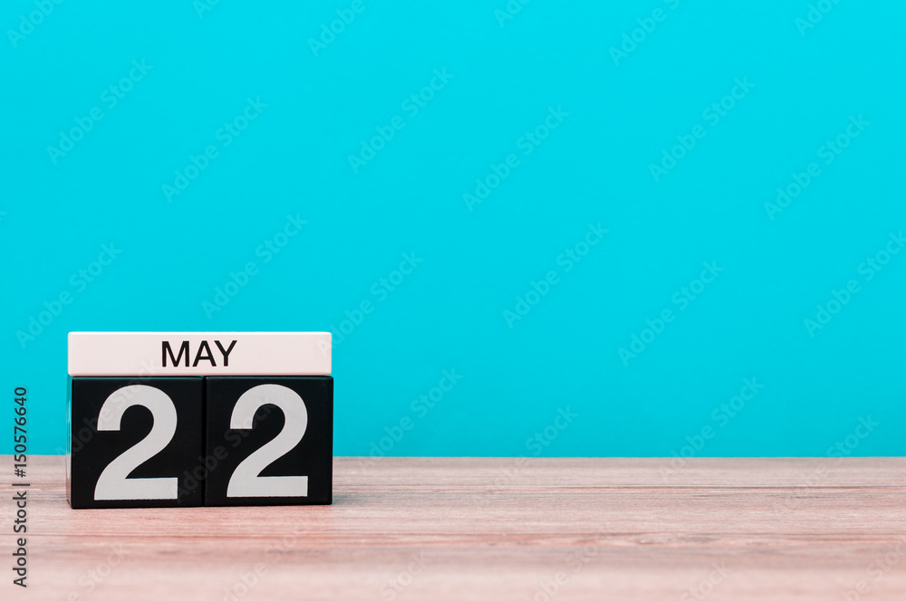 May 22nd. Day 22 of month, calendar on turquoise background. Spring time, empty space for text May 22nd. Day 22 of month, calendar on turquoise background. Spring time, empty space for text