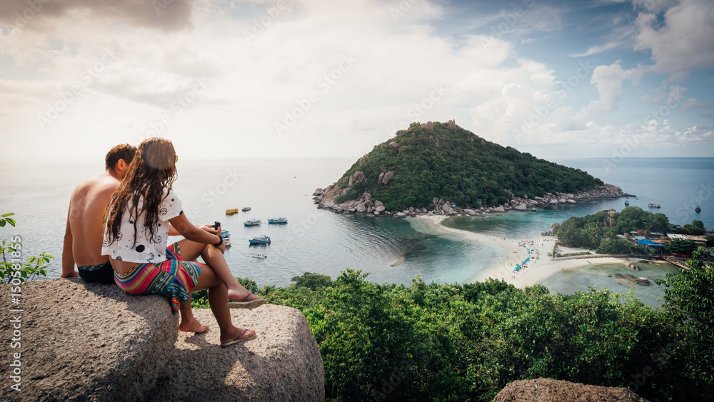 Happy Romantic Couple Enjoying at viewpoint on island,Travel Vacation Lifestyle summer Concept.Tropical paradise on the island of Koh nang yuan in Thailand,vintage tone