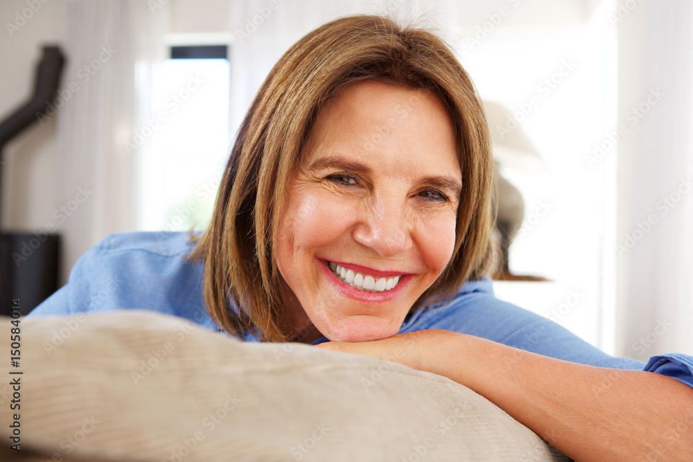 Close up happy older woman smiling at home Close up happy older woman smiling at home