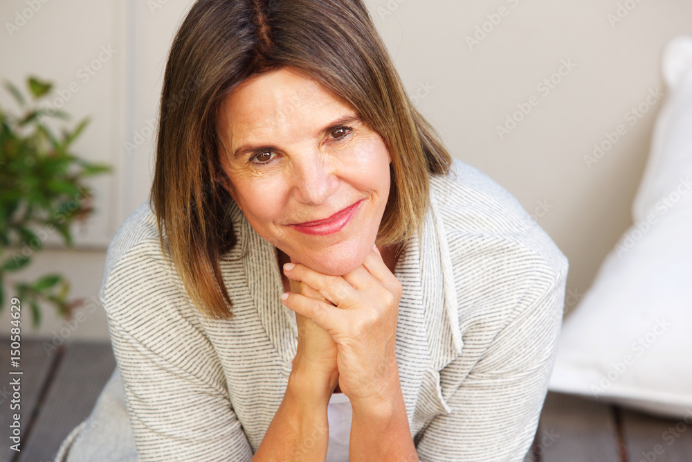 attractive older woman smiling and sitting outside attractive older woman smiling and sitting outside