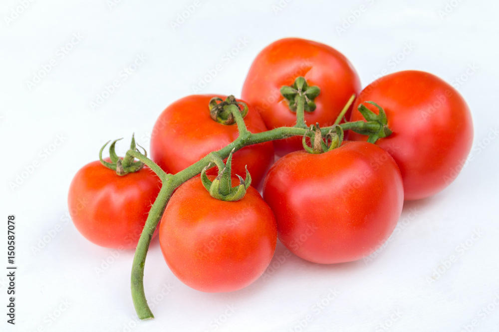 Close up red cherry tomato on white background isolated. Close up red cherry tomato on white background isolated.