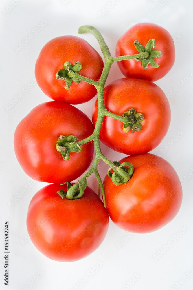 Close up red cherry tomato on white background isolated. Close up red cherry tomato on white background isolated.