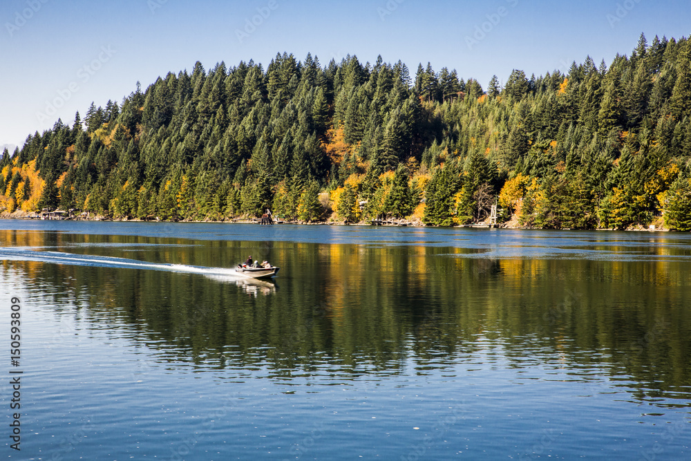 Passengers travelling in motor speed boat moving over Columbia River Gorge Passengers travelling in motor speed boat moving over Columbia River Gorge