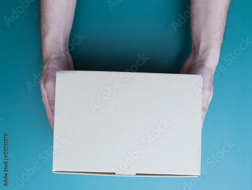 Fotografie Hand holding a box