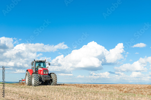 tractor in the lands along with gear for work.