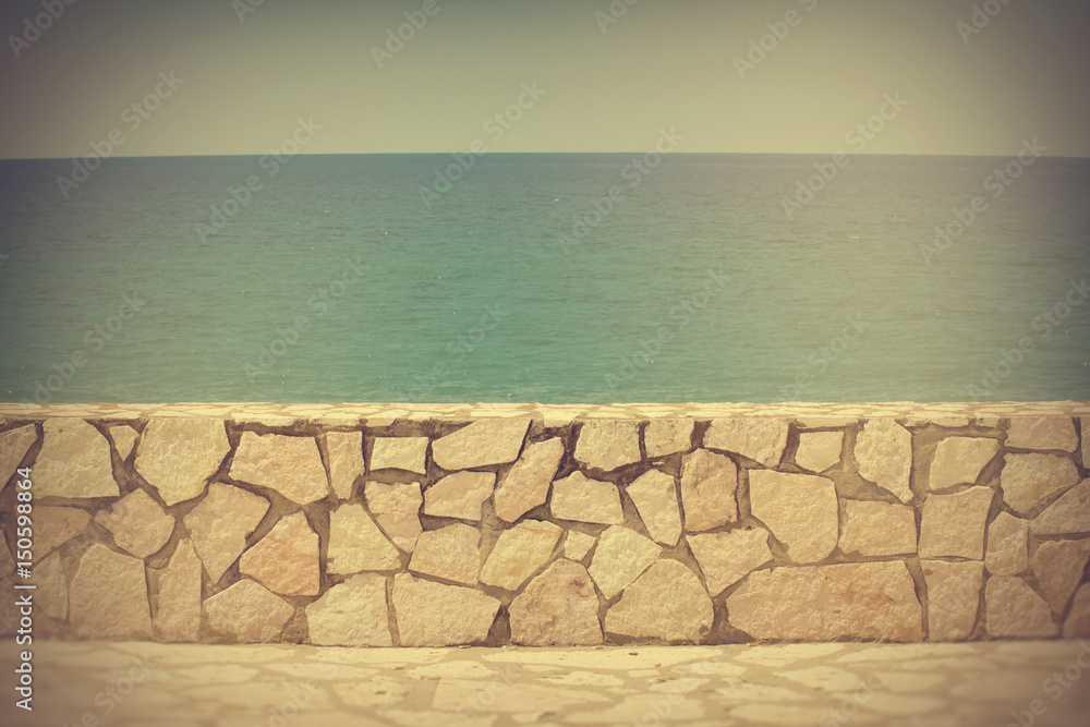 Background small wall by the shore in Sicily, Italy