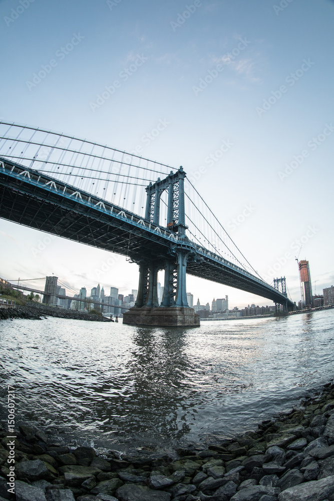 New York City's Manhattan Bridge at suset - DUMBO, Brooklyn. Shot with a fisheye lens during the spring of 2017.
