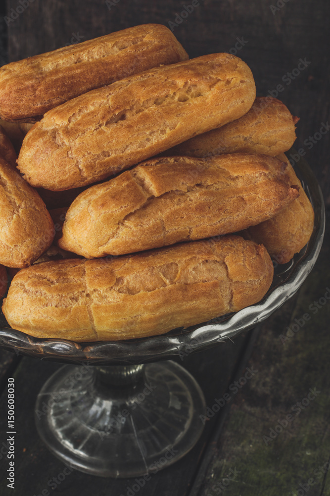 Eclairs - brewed cakes with filling (profiteroles) Eclairs - brewed cakes with filling (profiteroles)