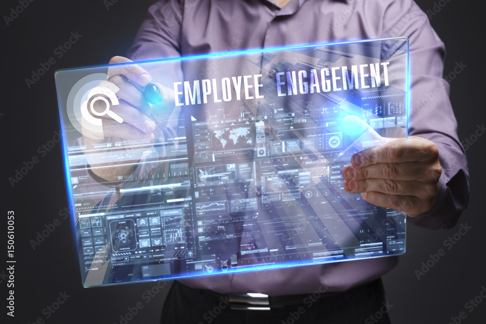 Business, Technology, Internet and network concept. Young businessman working on a virtual screen of the future and sees the inscription: Employee engagement Business, Technology, Internet and network concept. Young businessman working on a virtual screen of the future and sees the inscription: Employee engagement