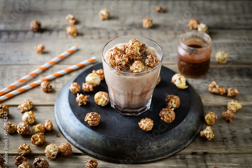 Cocoa with chocolate popcorn on a wooden table