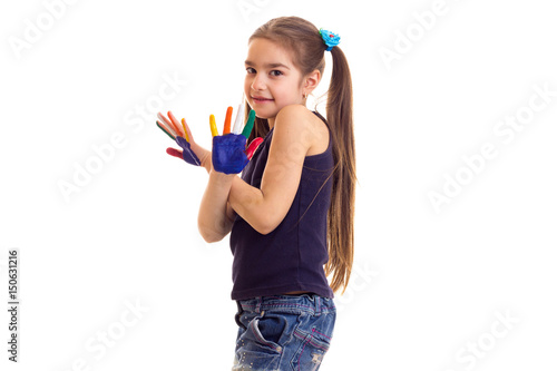 Little girl with colored hands
