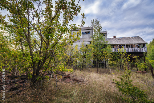 Grain elevator in collective farm near Zymovyshche ghost village in Chernobyl Exclusion Zone, Ukraine photo