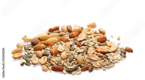 Healthy mix of salty and spicy peanuts, almonds, sunflowers, and pumpkin seeds, isolated on white background