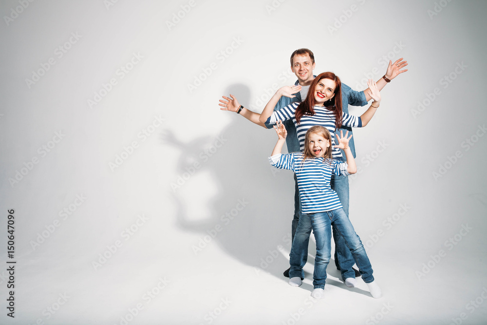 Happy family portrait standing on white background isolated