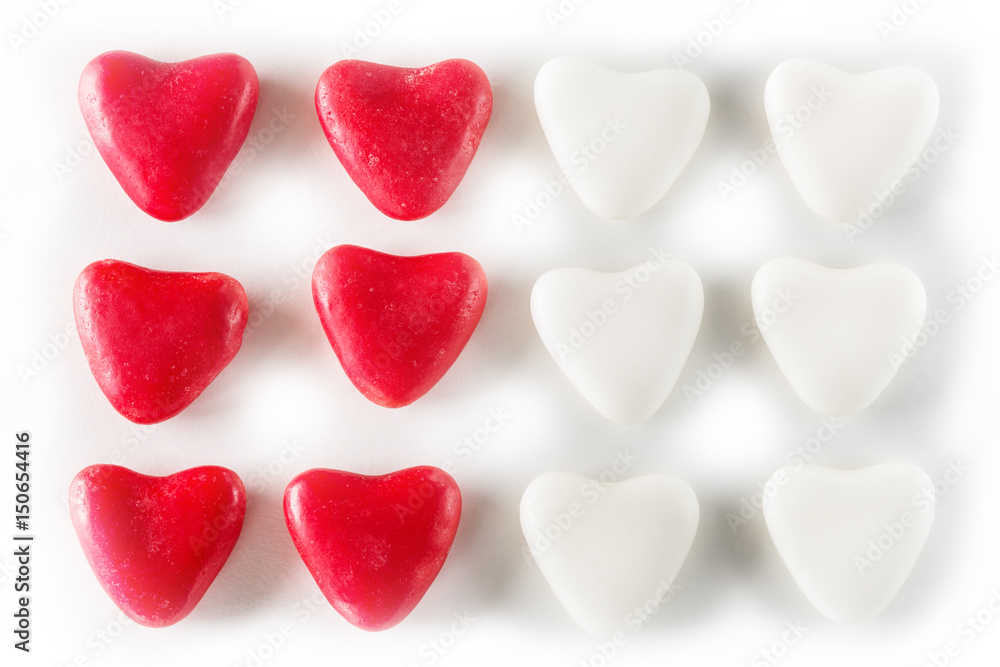 Red and white candy valentines hearts isolated on white background.