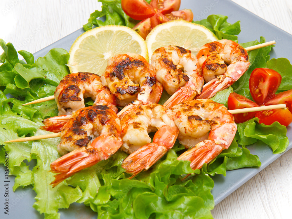 plate of grilled prawns with salad and cherry tomatoes plate of grilled prawns with salad and cherry tomatoes