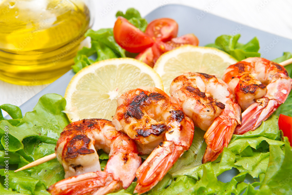 plate of grilled prawns with salad and cherry tomatoes plate of grilled prawns with salad and cherry tomatoes