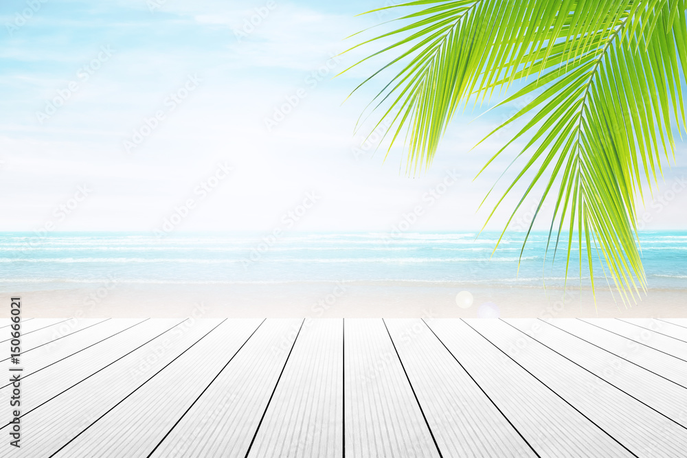 Empty wooden table and palm leafs with party on beach background blurred. Concept Summer, Beach, Sea, Relax, Party. Empty wooden table and palm leafs with party on beach background blurred. Concept Summer, Beach, Sea, Relax, Party.