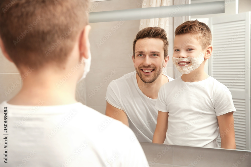 Fototapeta premium Father and son shaving in bathroom