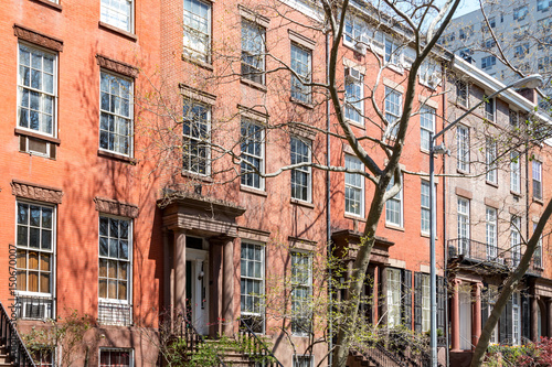 Block of historic brownstone buildings in Manhattan, New York City © deberarr