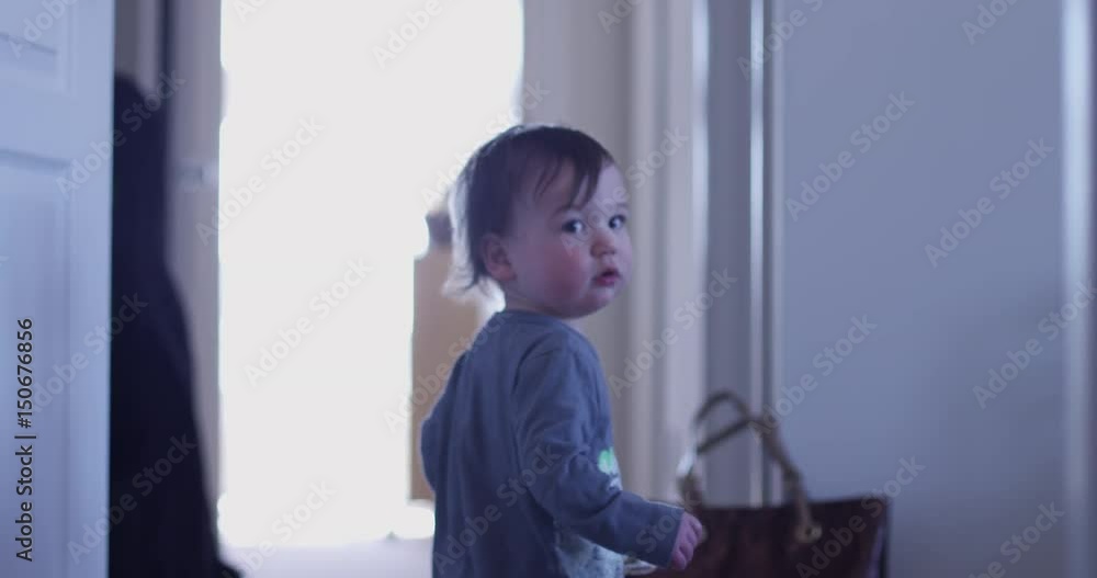 Young boy standing in hallway looking back Young boy standing in hallway looking back